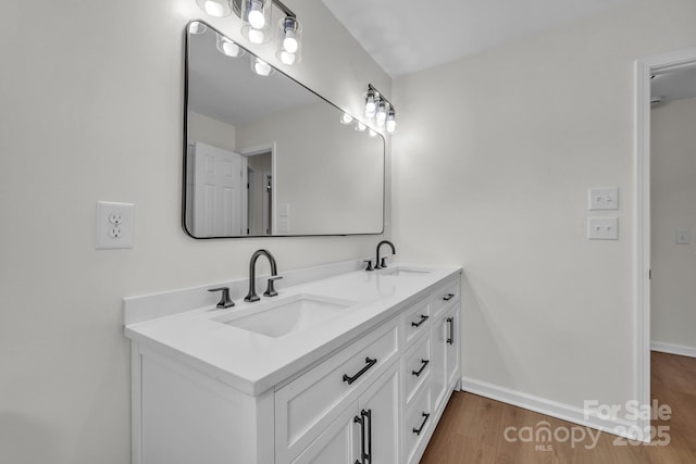 276 Bob Mcneill Rd, West Jefferson, NC 28694 - bathroom with wood finished floors, double vanity, and baseboards