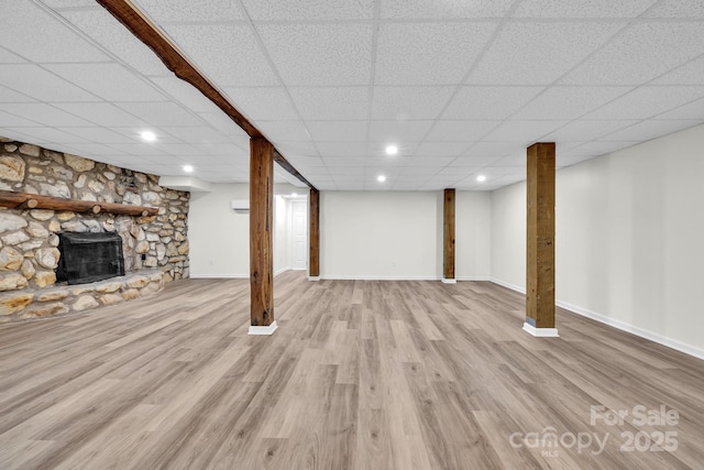 276 Bob Mcneill Rd, West Jefferson, NC 28694 - finished below grade area with a fireplace, a paneled ceiling, wood finished floors, baseboards, and recessed lighting