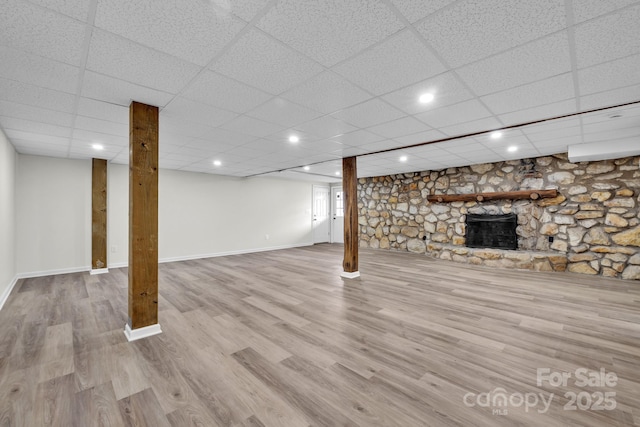 276 Bob Mcneill Rd, West Jefferson, NC 28694 - finished basement featuring a stone fireplace, wood finished floors, and baseboards