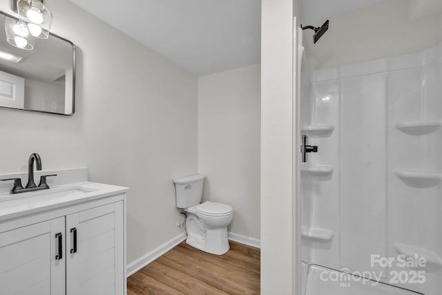 276 Bob Mcneill Rd, West Jefferson, NC 28694 - full bathroom featuring toilet, wood finished floors, a shower, and vanity