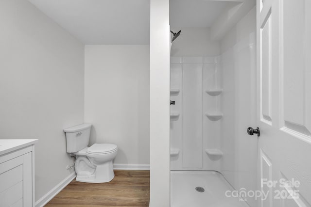 276 Bob Mcneill Rd, West Jefferson, NC 28694 - bathroom with toilet, wood finished floors, a shower, vanity, and baseboards