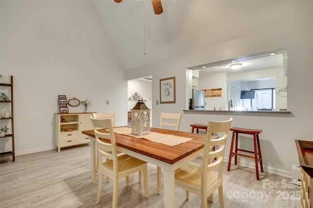 115 Pine Grove Cir, Clover, SC 29710 - dining room featuring light wood-style flooring, high vaulted ceiling, baseboards, and a ceiling fan