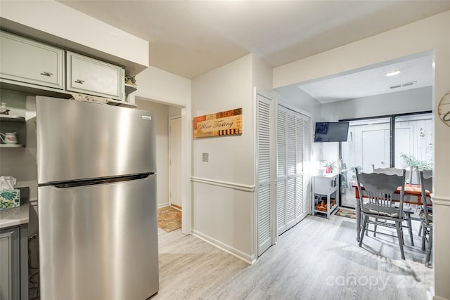 115 Pine Grove Cir, Clover, SC 29710 - kitchen featuring freestanding refrigerator, light wood-style flooring, light countertops, open shelves, and baseboards