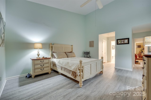 115 Pine Grove Cir, Clover, SC 29710 - bedroom with light wood-type flooring, baseboards, a towering ceiling, and ceiling fan