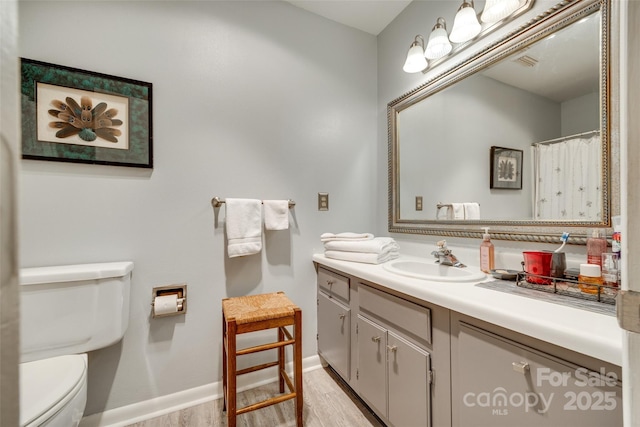 115 Pine Grove Cir, Clover, SC 29710 - full bathroom with wood finished floors, toilet, vanity, and baseboards