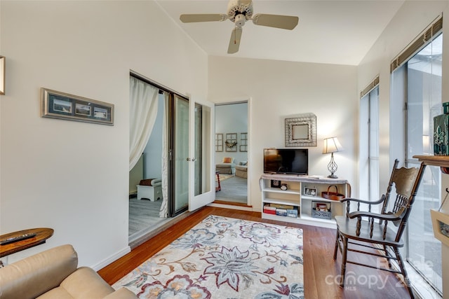 115 Pine Grove Cir, Clover, SC 29710 - living room featuring wood finished floors, ceiling fan, baseboards, and vaulted ceiling