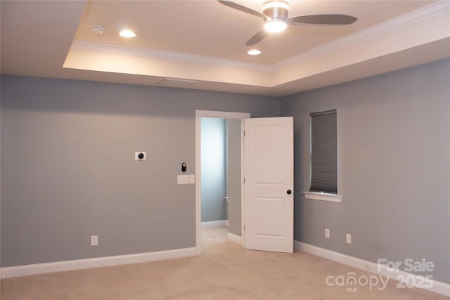 745 Garrett Green Way, Fort Mill, SC 29715 - unfurnished room with ornamental molding, a raised ceiling, a ceiling fan, carpet flooring, and baseboards