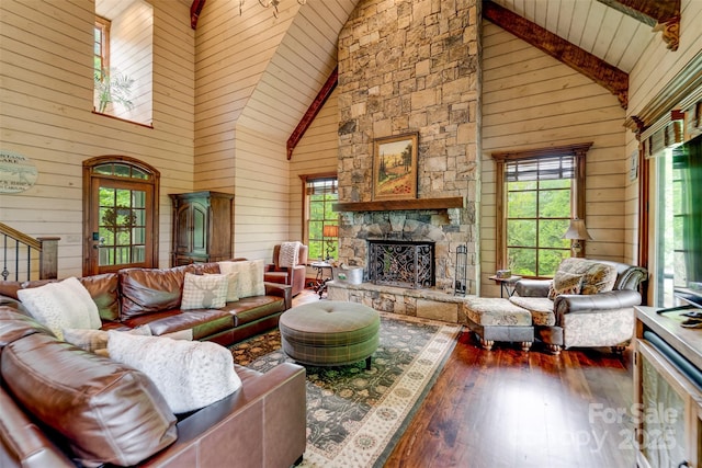 414 Trails End Rd, Bryson City, NC 28713 - living area with high vaulted ceiling, hardwood / wood-style flooring, wooden walls, a fireplace, and beamed ceiling