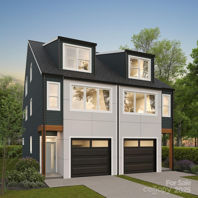 contemporary house with an attached garage and concrete driveway