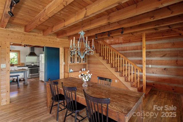 225 Ford Rd, Waynesville, NC 28786 - dining space with a chandelier, wood finished floors, wood ceiling, stairs, and rail lighting