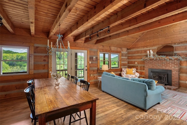225 Ford Rd, Waynesville, NC 28786 - living room with wood ceiling, wooden walls, wood finished floors, and track lighting