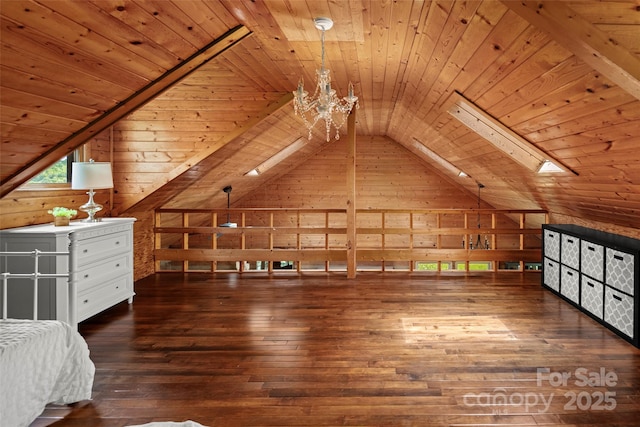 225 Ford Rd, Waynesville, NC 28786 - unfurnished bedroom featuring wood walls, lofted ceiling, wooden ceiling, hardwood / wood-style flooring, and a chandelier