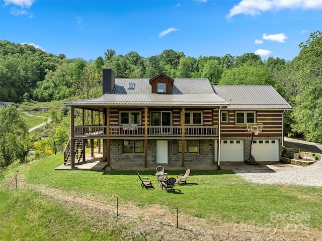 225 Ford Rd, Waynesville, NC 28786 - back of house featuring stairway, driveway, a chimney, a yard, and a fire pit