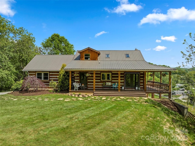225 Ford Rd, Waynesville, NC 28786 - rear view of house featuring a yard, metal roof, and log exterior
