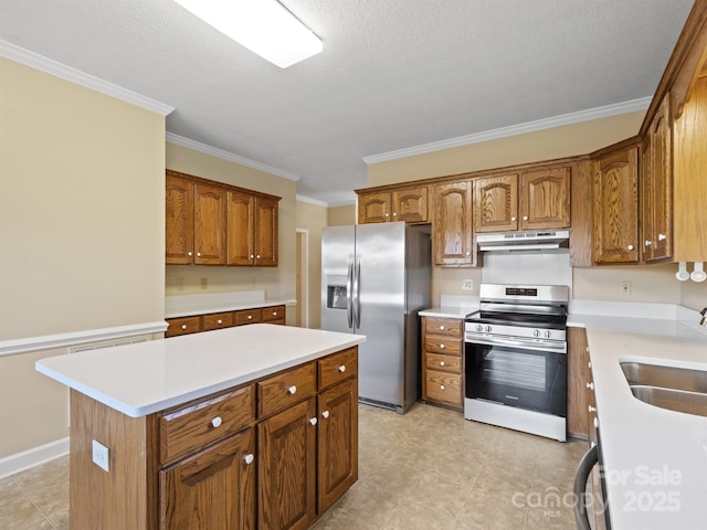 kitchen featuring stainless steel appliances, under cabinet range hood, a sink, crown molding, and light countertops