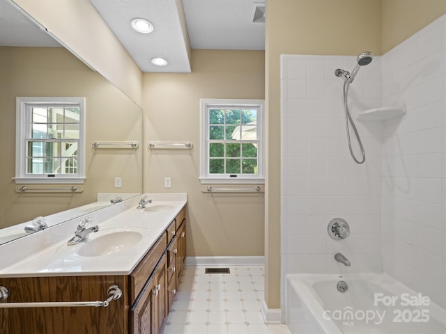 full bathroom with baseboards, bathing tub / shower combination, double vanity, and tile patterned floors