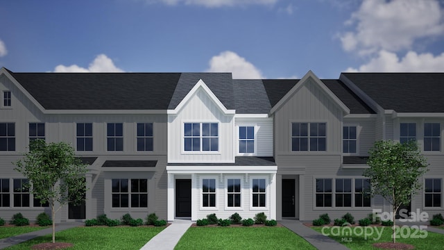 2906 Sloan Dr, Charlotte, NC 28208 - view of front facade with a front yard and board and batten siding