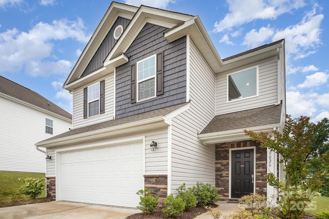 18026 Stark Way, Charlotte, NC 28278 - craftsman house with stone siding, a garage, driveway, and a shingled roof