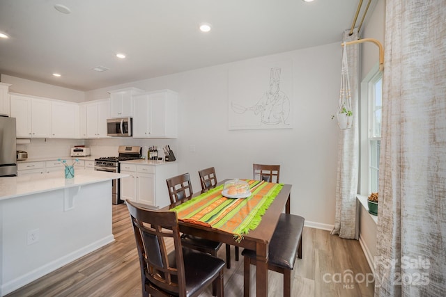 18026 Stark Way, Charlotte, NC 28278 - dining area with light wood-style flooring, baseboards, and recessed lighting