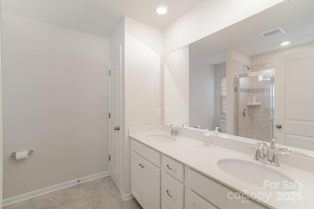 18026 Stark Way, Charlotte, NC 28278 - bathroom featuring a shower stall, double vanity, and baseboards