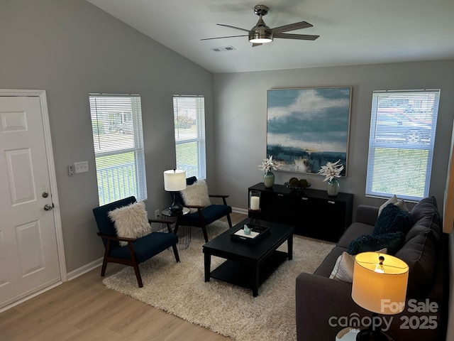1004 Johnson St, Charlotte, NC 28206 - living room featuring wood finished floors, ceiling fan, plenty of natural light, vaulted ceiling, and baseboards