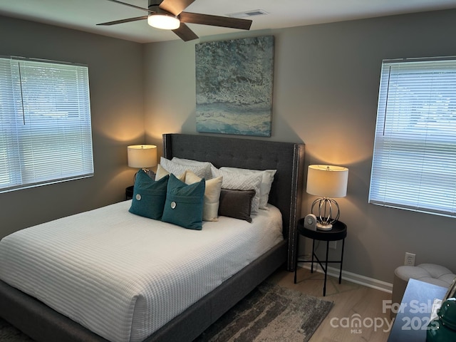 1004 Johnson St, Charlotte, NC 28206 - bedroom with wood finished floors, baseboards, and ceiling fan