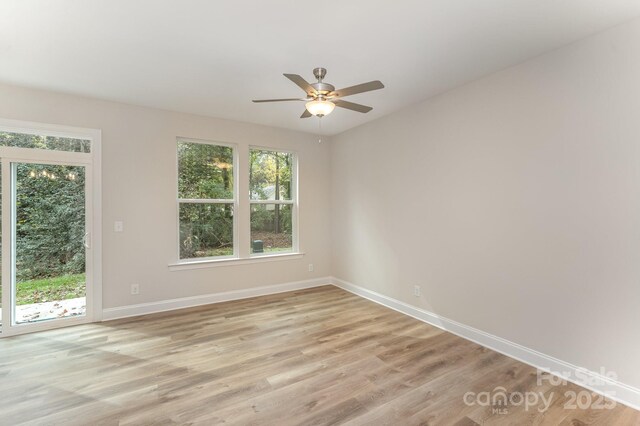 2818 Old Steele Creek Rd, Charlotte, NC 28208 - empty room featuring plenty of natural light, baseboards, and a ceiling fan