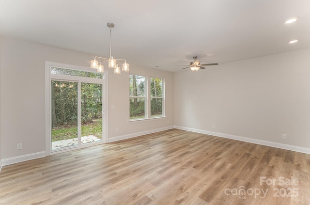 2818 Old Steele Creek Rd, Charlotte, NC 28208 - unfurnished room with baseboards, light wood-type flooring, a chandelier, recessed lighting, and a ceiling fan