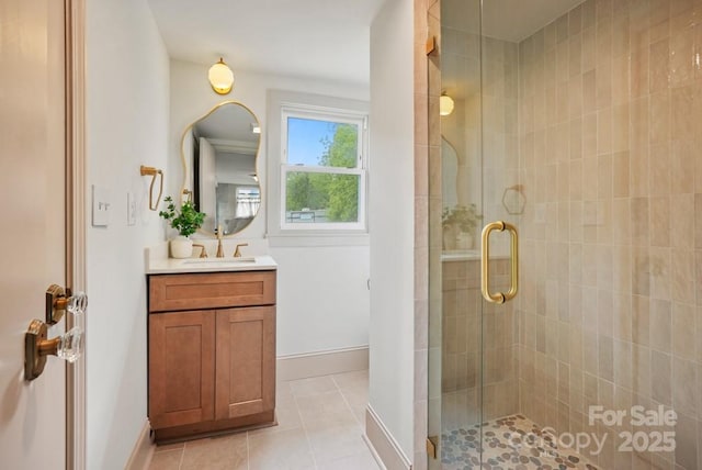 1000 Oakshade Ave, Kannapolis, NC 28083 - full bath with a stall shower, tile patterned flooring, vanity, and baseboards