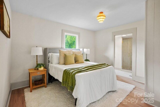 1000 Oakshade Ave, Kannapolis, NC 28083 - bedroom featuring light wood-style flooring and baseboards