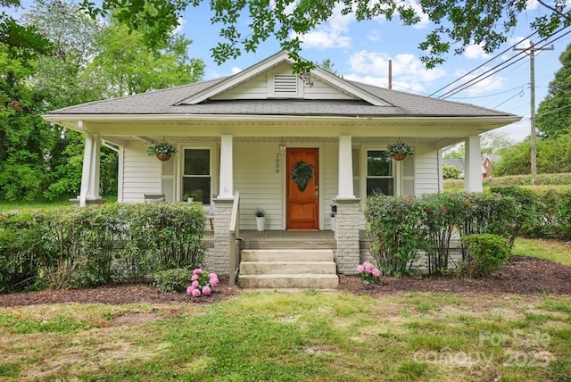 1000 Oakshade Ave, Kannapolis, NC 28083 - view of front of house featuring covered porch and roof with shingles