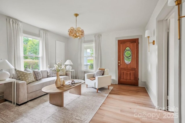 1000 Oakshade Ave, Kannapolis, NC 28083 - living area featuring light wood-style floors and a chandelier