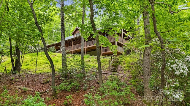 108 Cougar Aly Unit 79, Lake Lure, NC 28746 - rear view of property with a deck and a view of trees