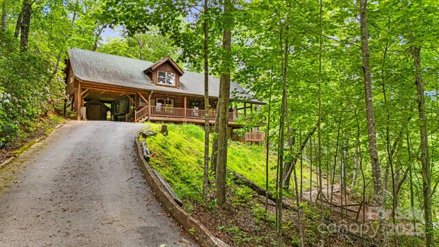 108 Cougar Aly Unit 79, Lake Lure, NC 28746 - view of front of house featuring asphalt driveway and log siding
