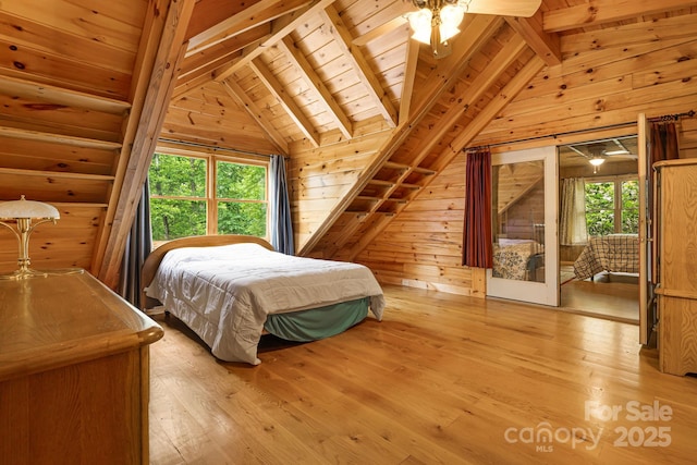 108 Cougar Aly Unit 79, Lake Lure, NC 28746 - bedroom with wood ceiling, light wood-type flooring, wood walls, and access to exterior