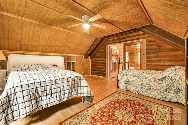 108 Cougar Aly Unit 79, Lake Lure, NC 28746 - bedroom featuring wood ceiling, rustic walls, wood finished floors, vaulted ceiling, and a ceiling fan