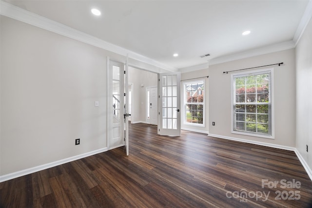 spare room with dark wood-type flooring, baseboards, ornamental molding, french doors, and recessed lighting