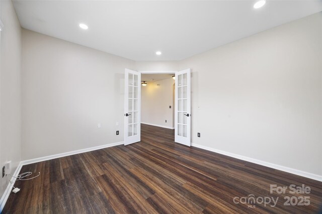 spare room featuring french doors, wood finished floors, baseboards, and recessed lighting