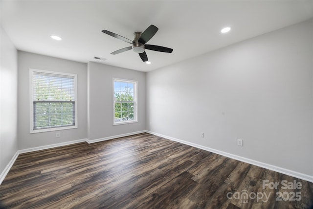 spare room with dark wood finished floors, baseboards, ceiling fan, and recessed lighting
