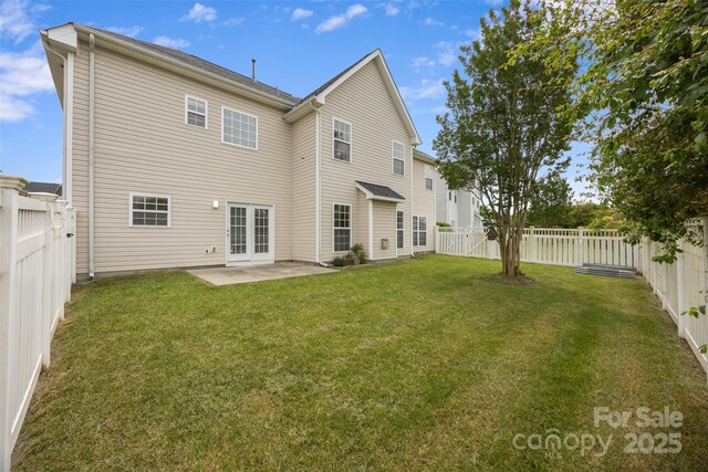 rear view of property featuring a patio and french doors
