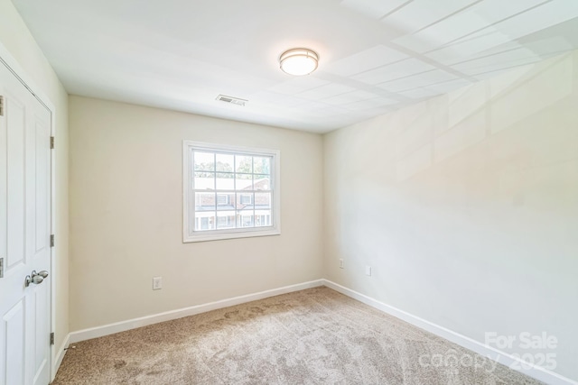 unfurnished bedroom featuring carpet and baseboards
