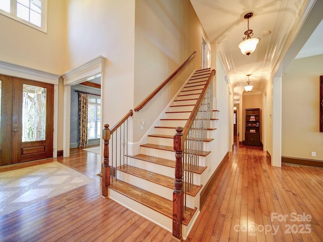 200 Waterby Way, Matthews, NC 28104 - foyer entrance featuring light wood-type flooring, stairway, crown molding, and baseboards