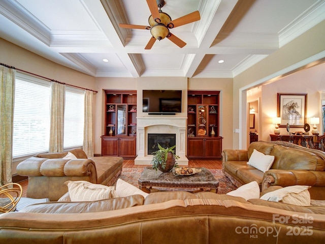 200 Waterby Way, Matthews, NC 28104 - living area with ceiling fan, coffered ceiling, wood finished floors, crown molding, and a fireplace