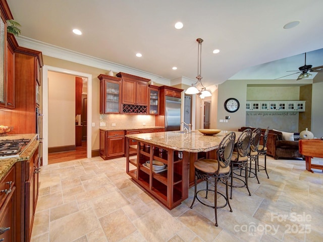 200 Waterby Way, Matthews, NC 28104 - kitchen with appliances with stainless steel finishes, stone tile flooring, open floor plan, ornamental molding, and ceiling fan