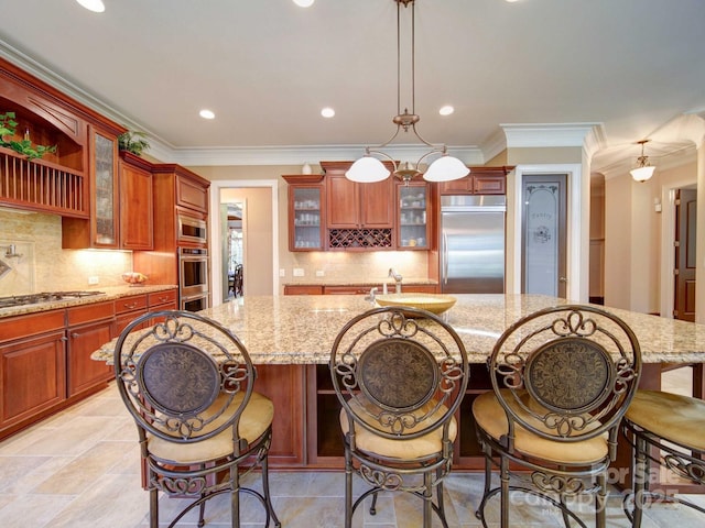 200 Waterby Way, Matthews, NC 28104 - kitchen featuring built in appliances, light stone countertops, a large island, decorative backsplash, and ornamental molding