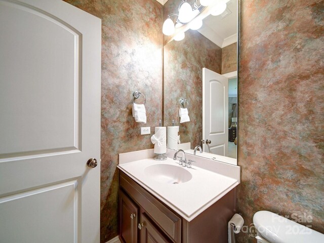 200 Waterby Way, Matthews, NC 28104 - bathroom with wallpapered walls, toilet, vanity, and a chandelier