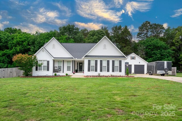 1140 Landsdown Dr, Salisbury, NC 28147 - view of front facade with a porch, driveway, an outdoor structure, a detached garage, and a shingled roof