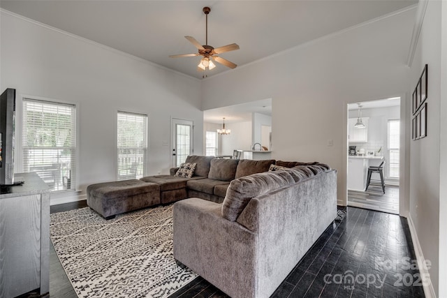 1140 Landsdown Dr, Salisbury, NC 28147 - living area with ceiling fan, dark wood-style flooring, crown molding, baseboards, and a towering ceiling