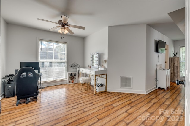 1140 Landsdown Dr, Salisbury, NC 28147 - home office with a ceiling fan, wood finished floors, and baseboards