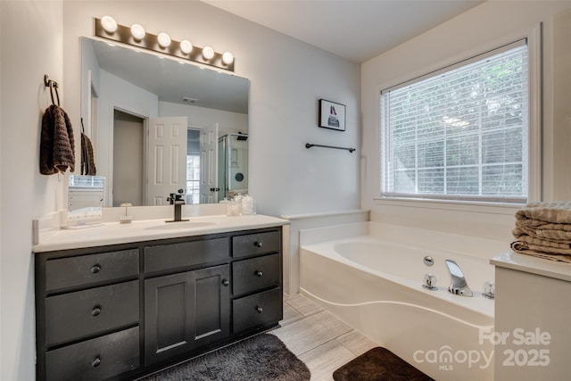 1140 Landsdown Dr, Salisbury, NC 28147 - bathroom with vanity, a bath, and a shower with door